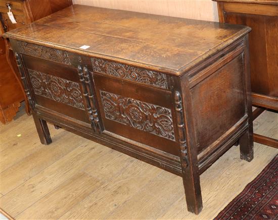 A 17th century style carved oak coffer W.119cm